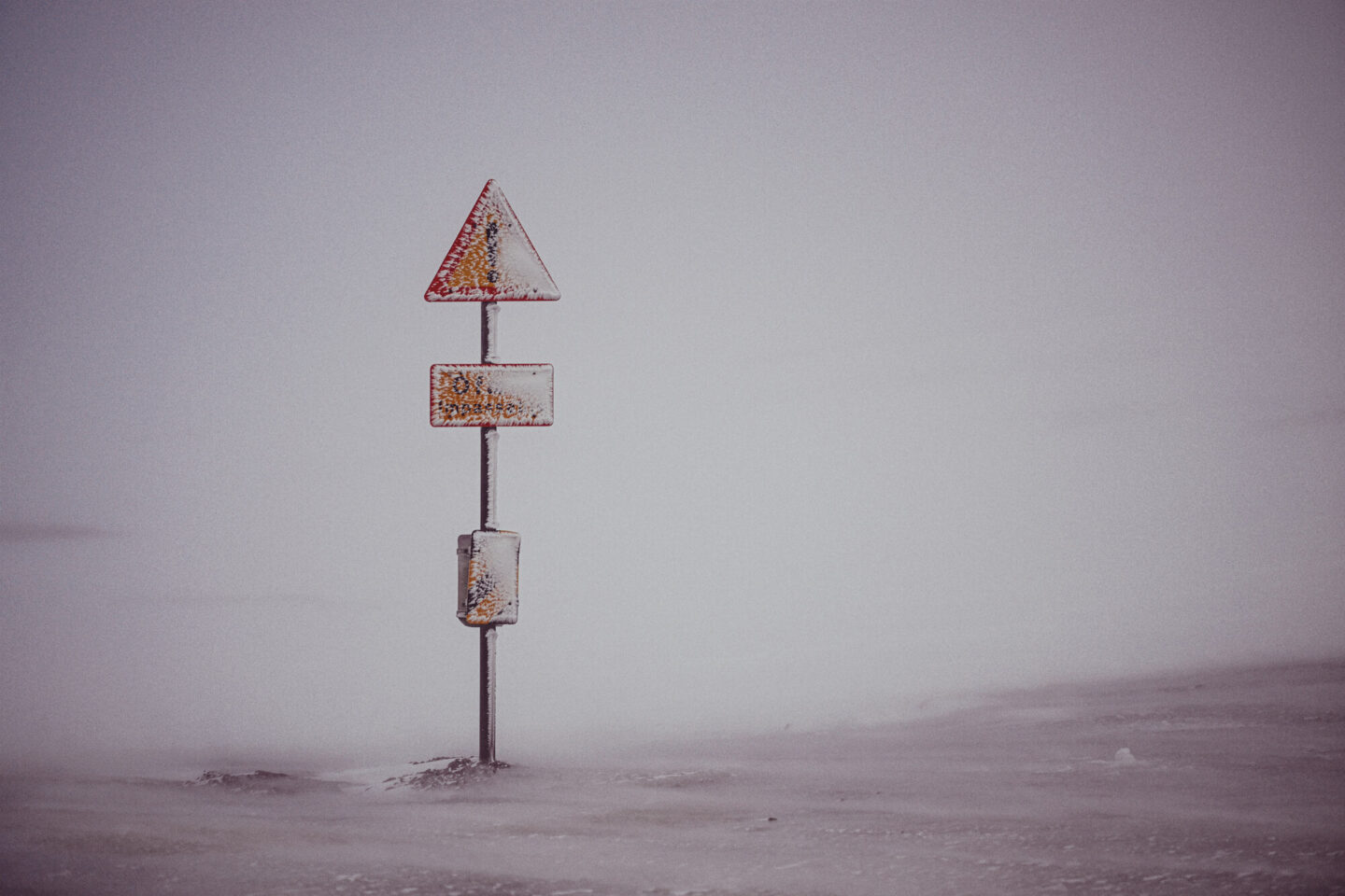 highland_base_snow_covered_sign