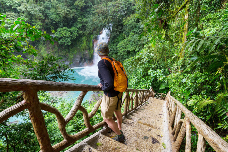 costa-rica-hiker-at-rio-celeste-waterfall-astk