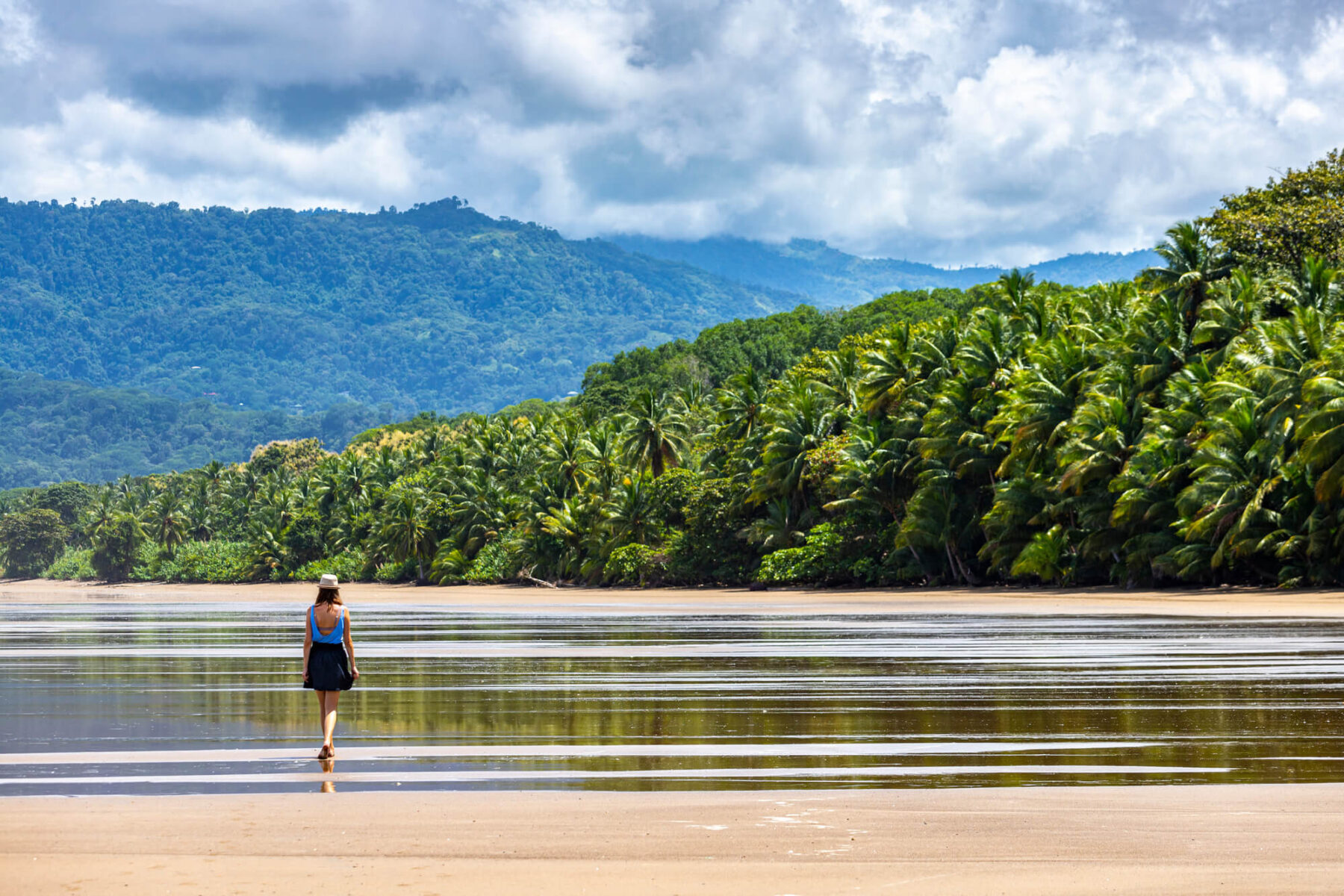 costa-rica-woman-walking-on-marino-beach-ballena-manuel-antonio-national-park-astk