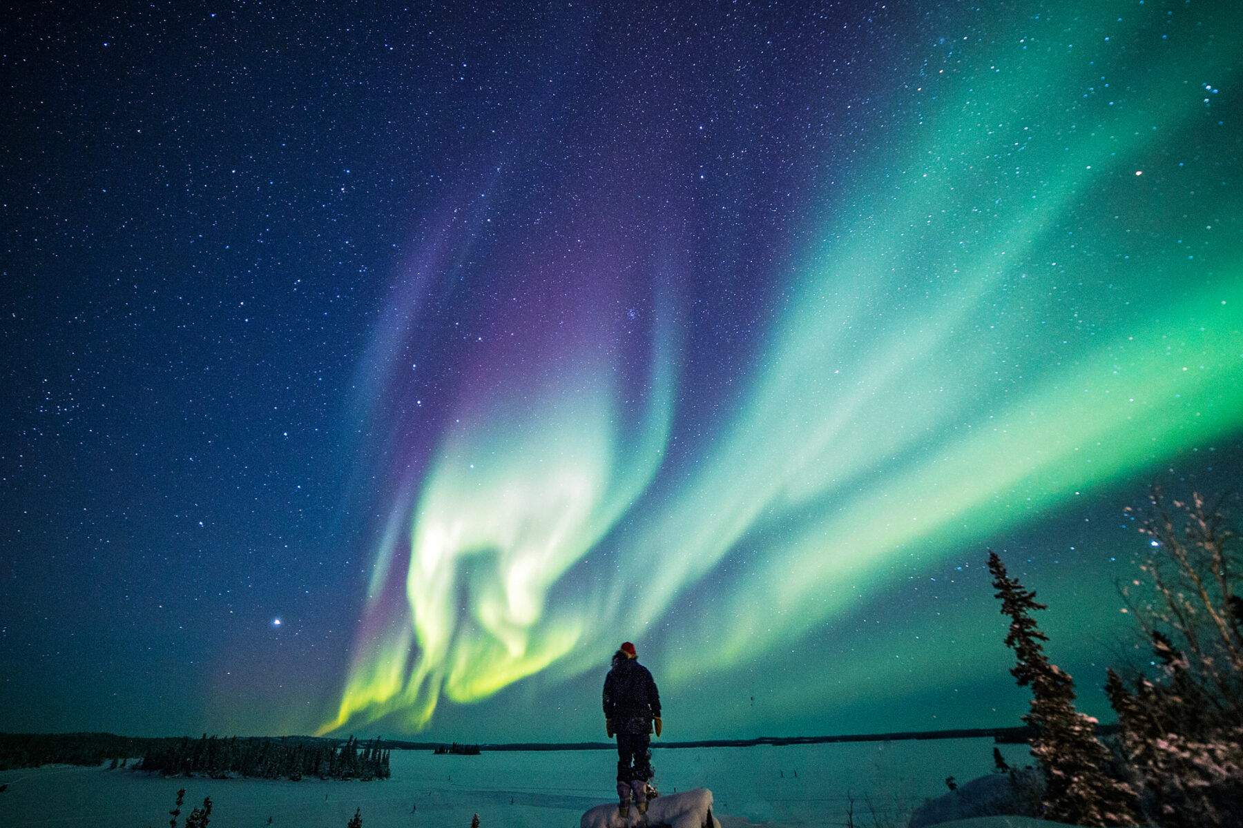 canada northwest territories blachford lake with lone figure and aurora bll