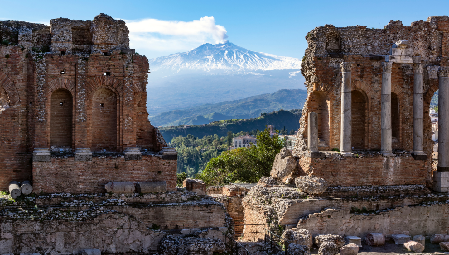 Picture of Mount Etna volcano in Italy between ancient ruins