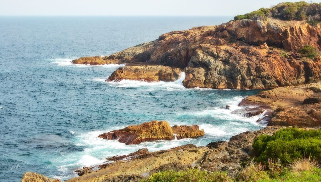 Picture of cliffs along the coast with the sea in the background