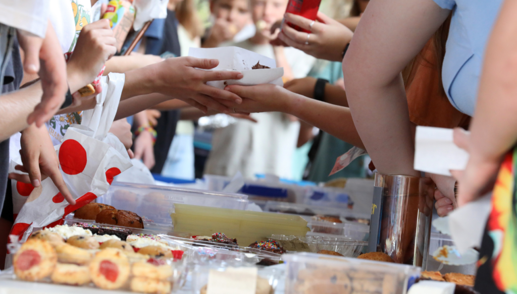 Picture of hands at a school bake sale