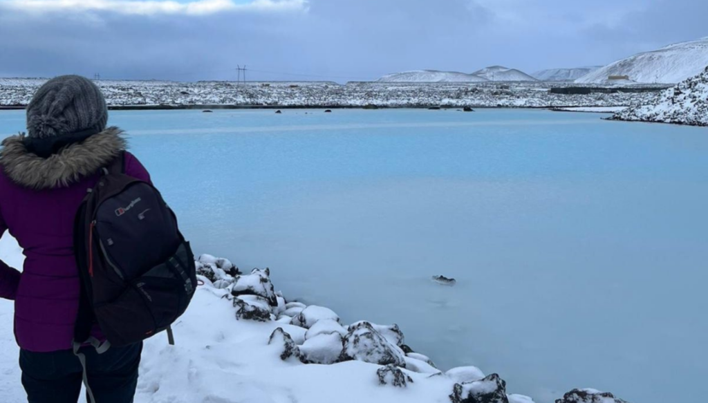 Picture of person looking at a glacier lagoon in Iceland