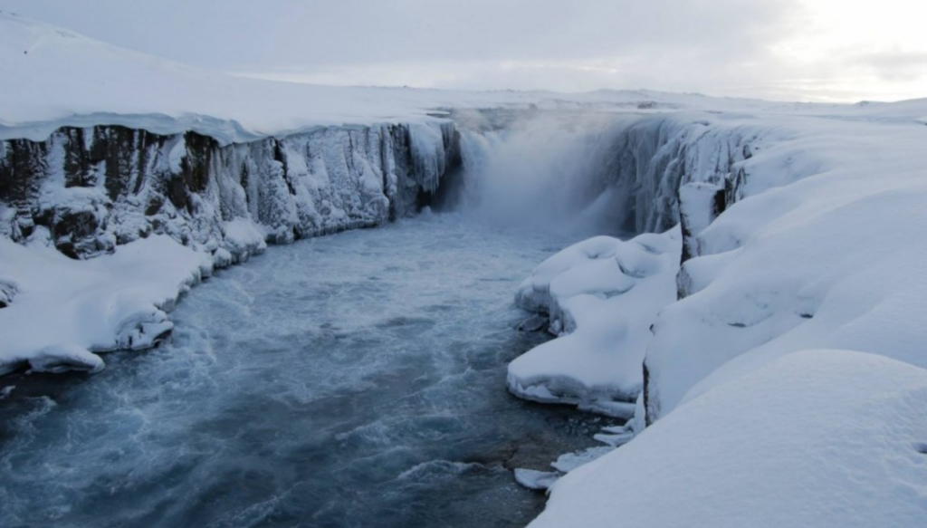 Picture of Dettifoss waterfall in Iceland in the Winter surrounded by snow