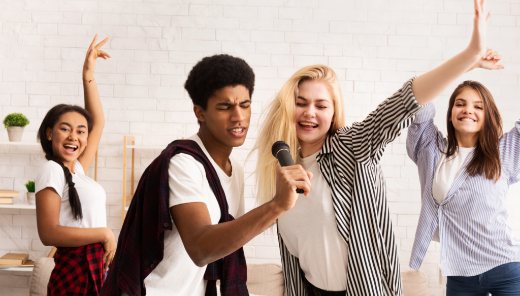 Picture of students singing and dancing